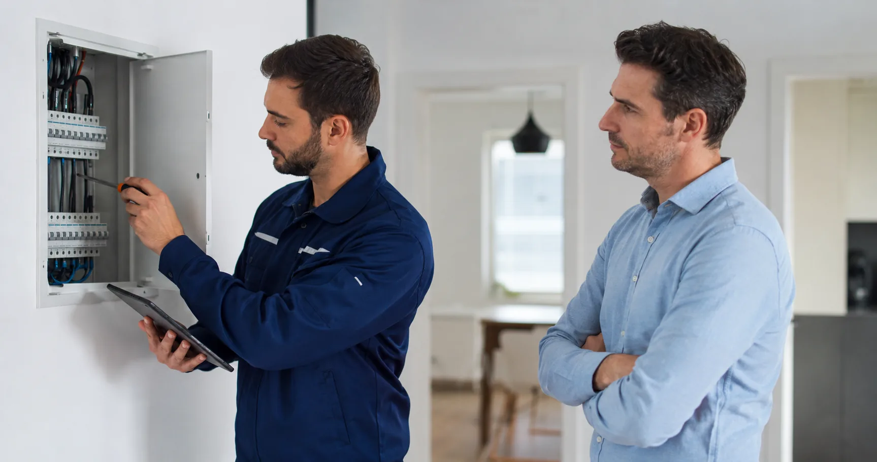 Electrician inspecting residential electrical components